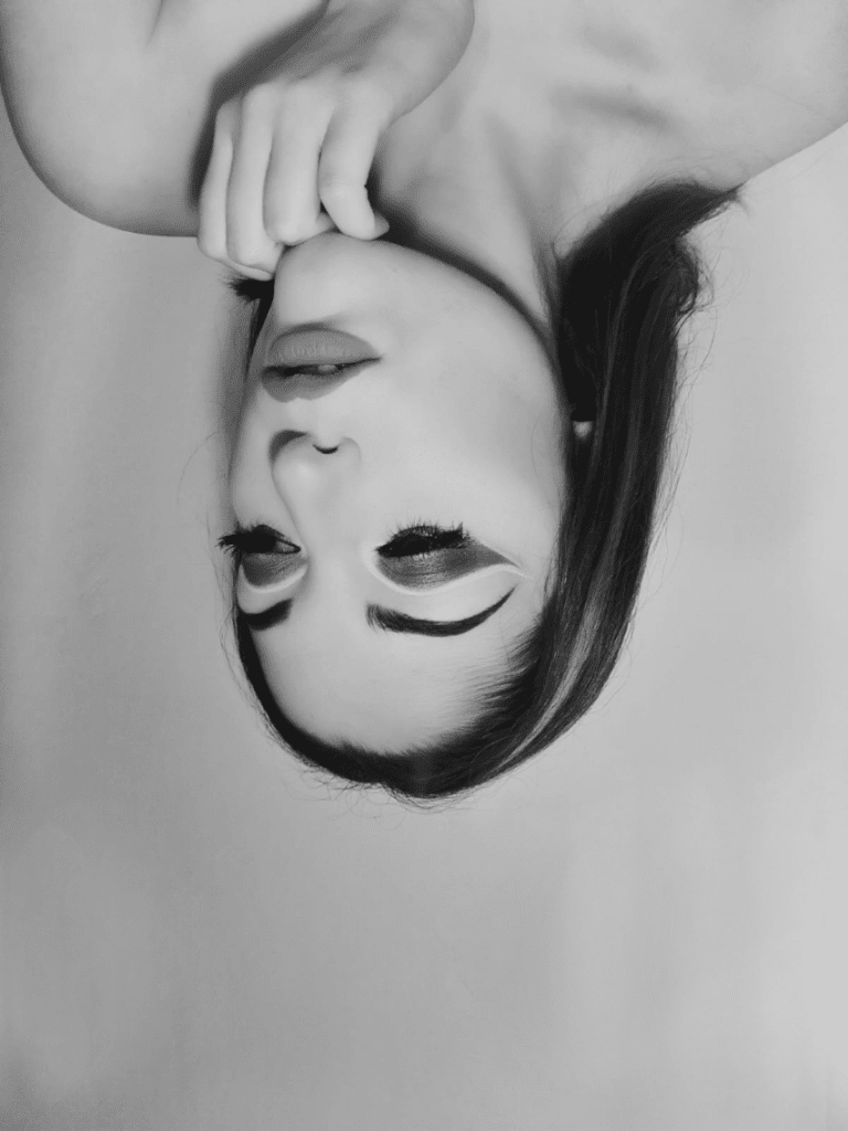 black and white image of a woman gazing upward-Alessia Andolfi Makeup Artist